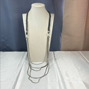 The Limited Multi-Strand Silver Tone Necklace with a Braided Gray Cord